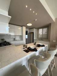 Modern dining space with large windows in Howard Panama Pacifico house