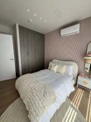 Spacious master bedroom featuring walk-in closet, AC, large windows in Panama Pacifico house