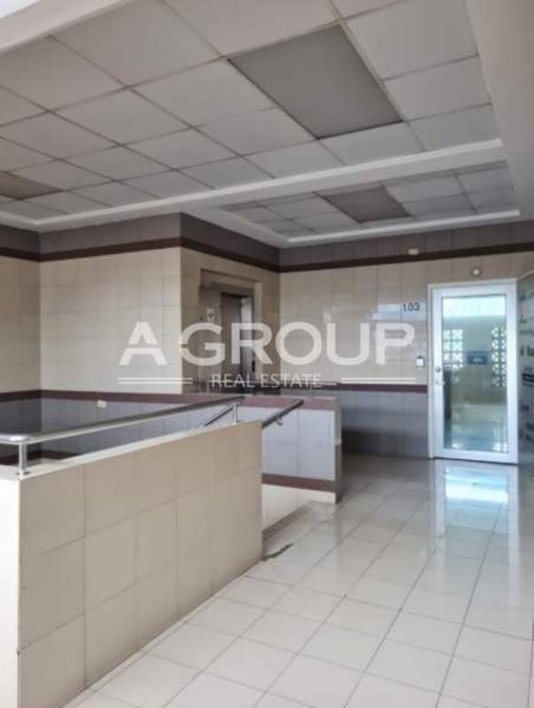 Covered rear parking area with concrete floor and city skyline view Plaza Calle 50 Obarrio Panama