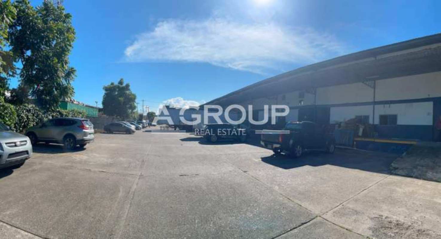Spacious paved parking lot with loading docks outside warehouse Juan Díaz Panama