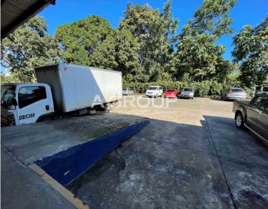 Commercial lot with trucks parked in front of industrial warehouse Panama City