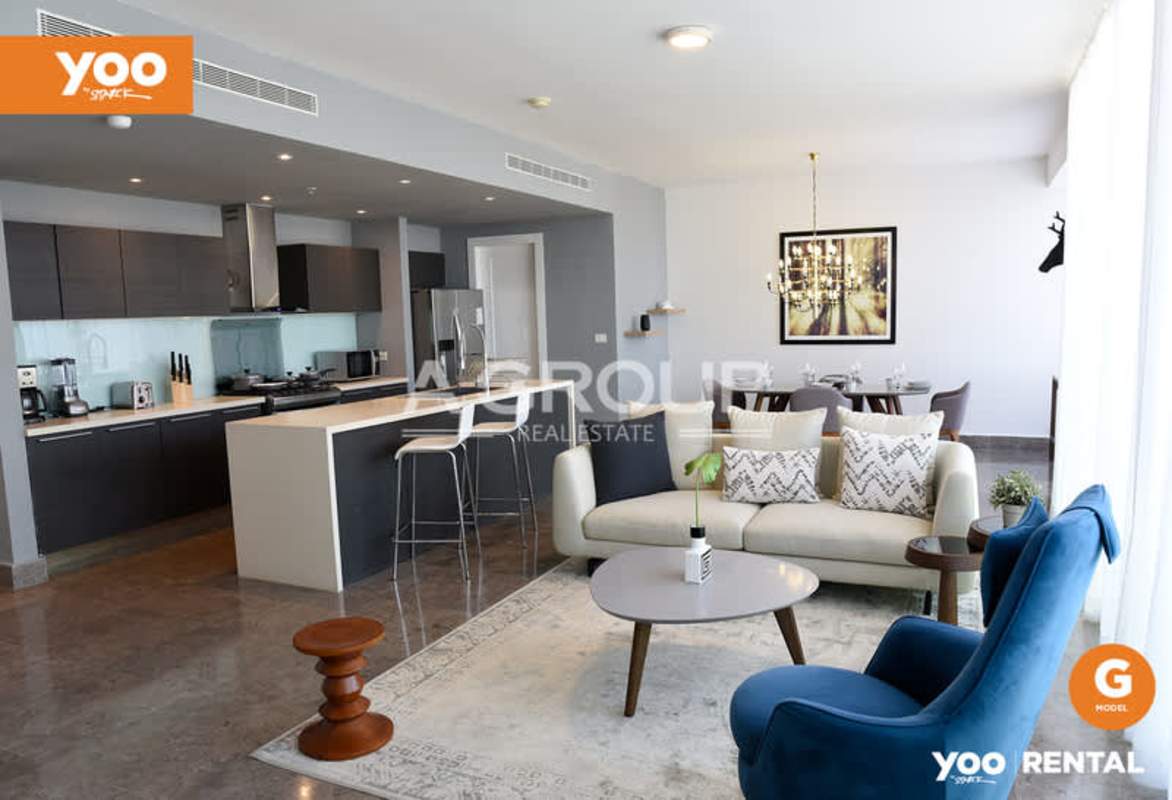Contemporary open concept living and kitchen area with designer furnishings in PH Yoo Panama rental