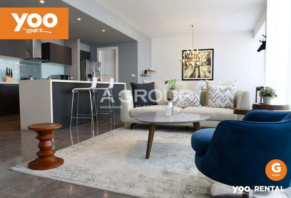 Modern designer kitchen with island and stainless appliances in PH Yoo Panama apartment on Avenida Balboa