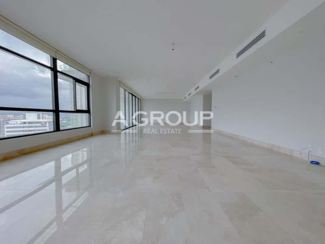 Spacious modern kitchen with large island, stone countertops, custom cabinetry PH Albatross Panama