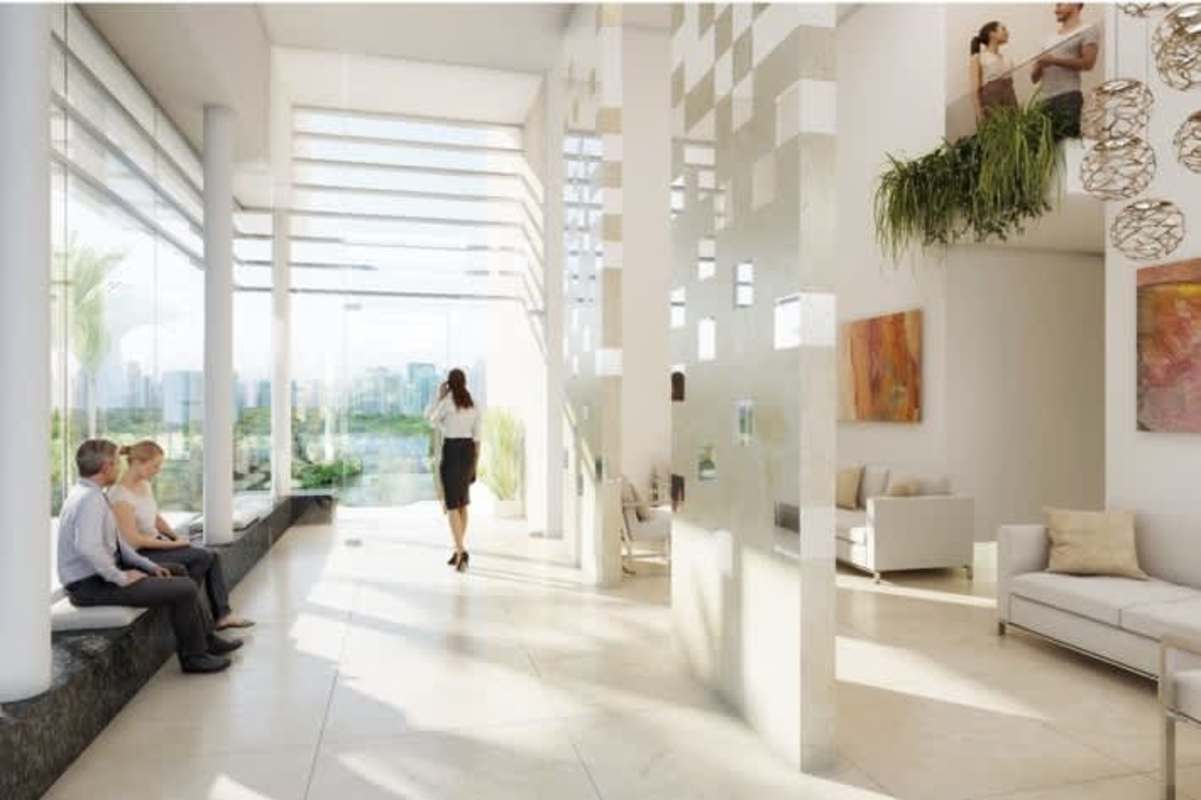 Contemporary open concept condo interior with kitchen island, sofa and dining in Green City Panama