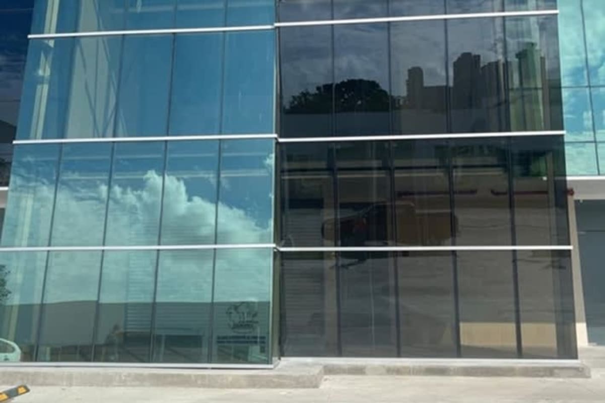 Contemporary commercial building with reflective glass facade in Panama Viejo Business Park