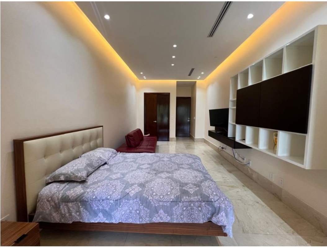 Modern kitchen with island granite counters appliances in The Reserve Santa Maria