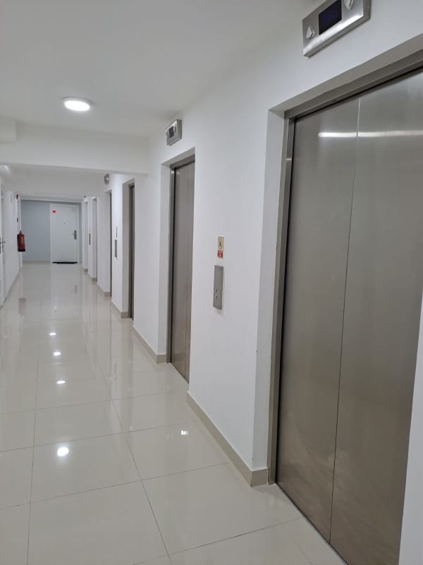 Modern elevator lobby with polished tiles PH Coral Plaza Tumba Muerto Panama