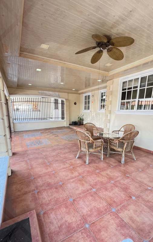 Bedroom with built-in closet ceiling fan and window in remodeled house in Paseo del Valle Villa Lucre