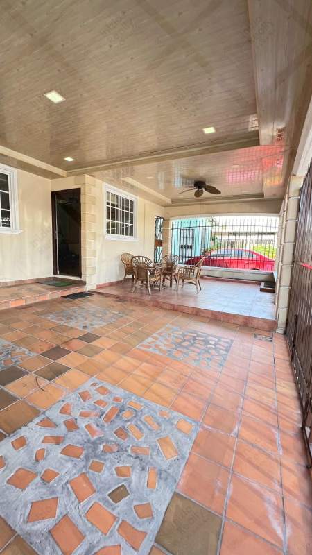 Bright living dining area with tiled floors and ceiling fan at remodeled house in Villa Lucre Panama City