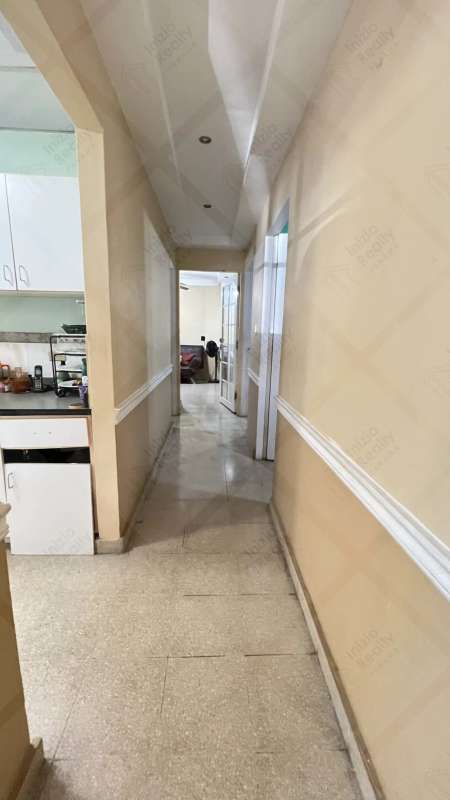 Guest bedroom with ceiling fan and closet in Villa Lucre remodeled house Panama City