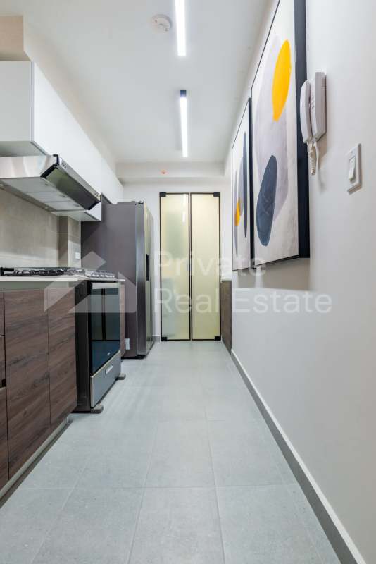Contemporary kitchen with laminate counters open dining area PH Park Square Rise Vía España