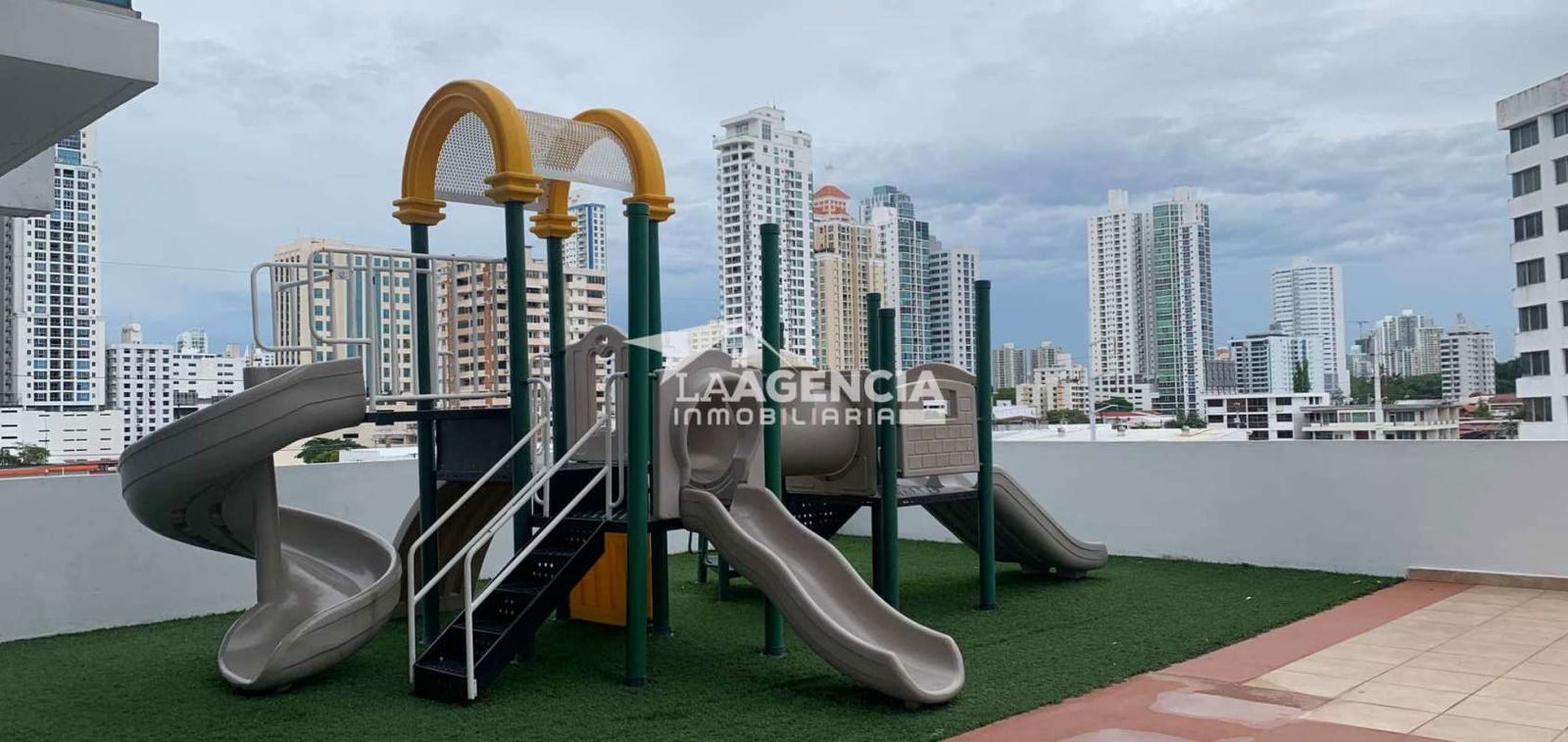 Children’s rooftop playground and terrace with city skyline at PH Famagosta San Francisco Panama