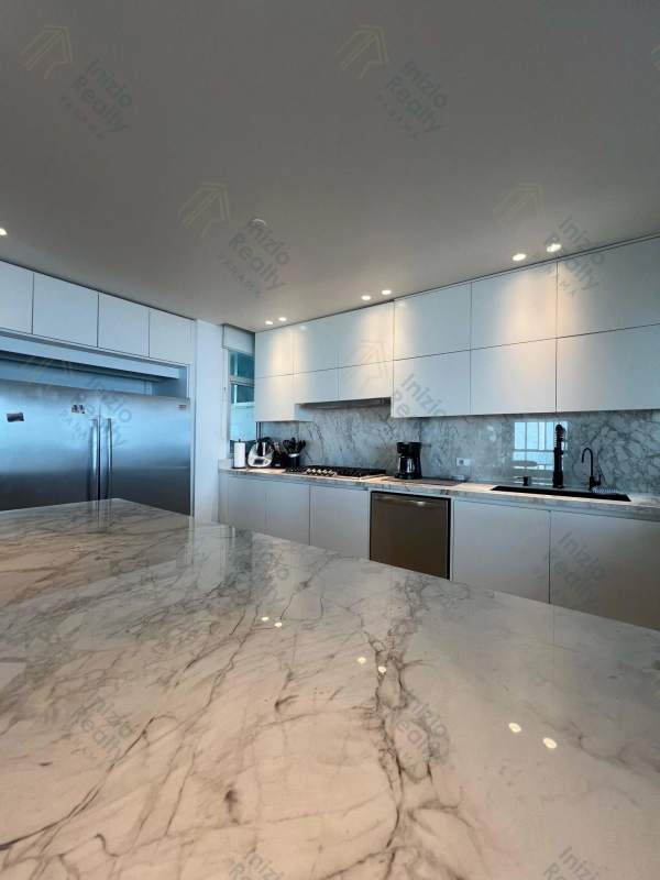 Sleek marble island kitchen with ocean views at PH Ocean Sky Coco del Mar Panama