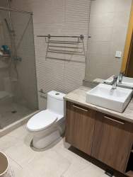 Contemporary kitchen with granite counters, stainless steel appliances at beachfront condo Playa Escondida Panama