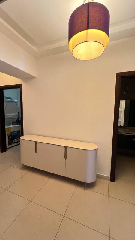 Modern dining space in luxury furnished apartment PH BICSA Tower with city views