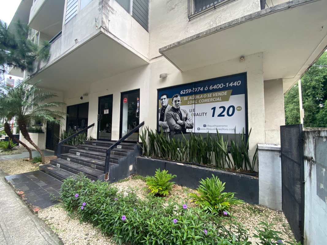 Facade of commercial space with glass frontage and tiled steps Obarrio Panama City