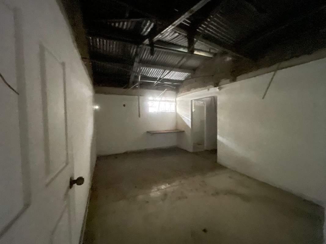 Basement or storage space with exposed ceiling on commercial lease land