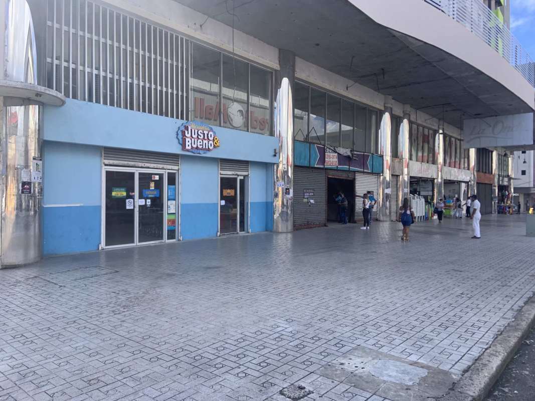 Exterior of commercial mall with wide shops glass windows on Avenida Peru Calidonia Panama