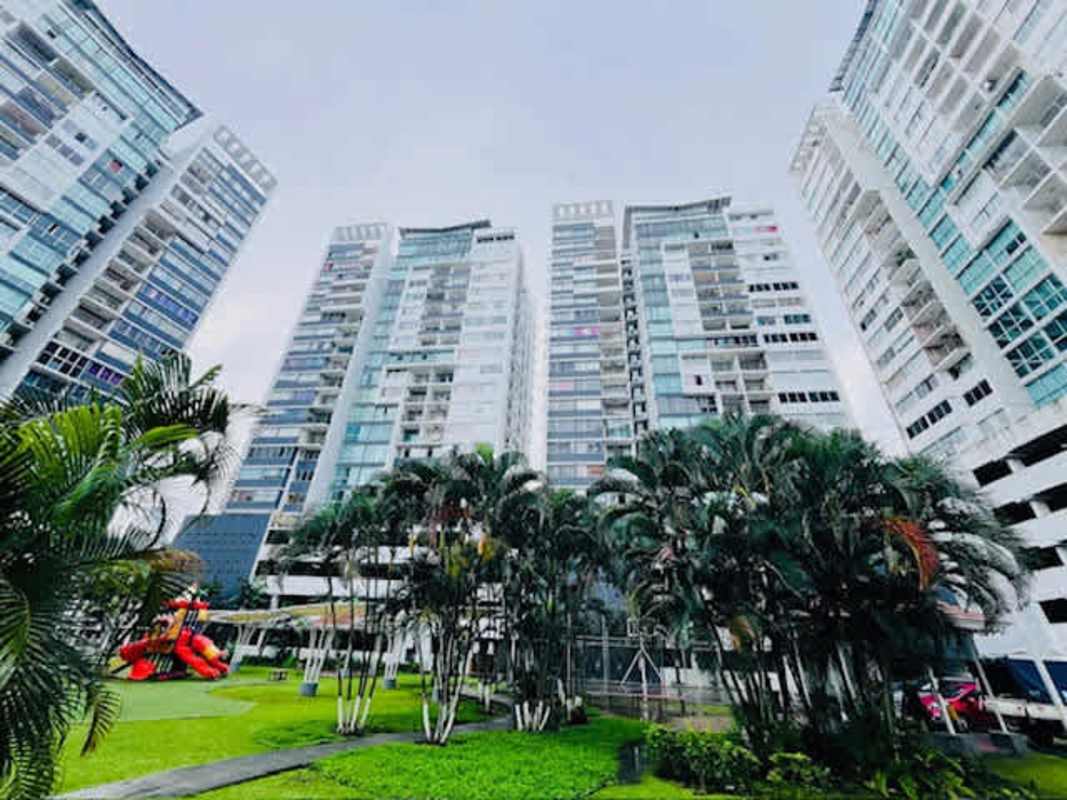 Kitchen with granite countertop wooden cabinets adjacent laundry area PH Central Park Panama