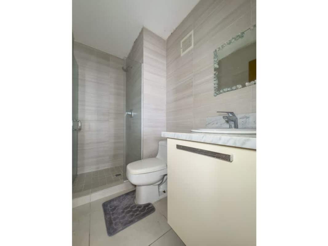 Bedroom with large window, built-in wardrobe, natural light in PH Park City Obarrio Panama City