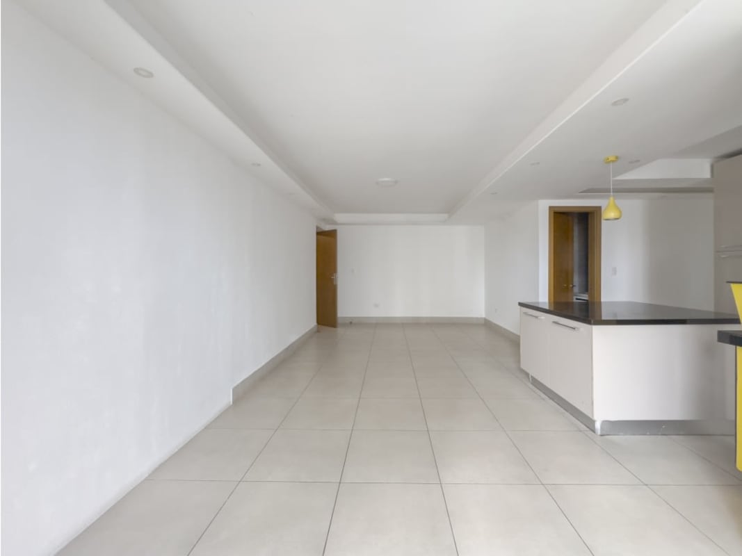Bedroom with custom closet doors and large ceramic tile flooring in PH Park City Panama