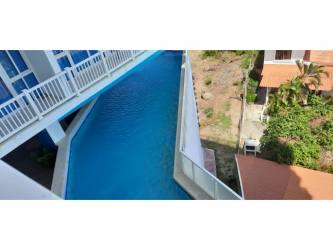 Modern infinity pool facing Pacific Ocean at PH Ibiza Playa Corona Panama beachfront condo