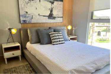 Bright bedroom with mountain view window at PH Brisas de Mar, Playa Caracol Panama