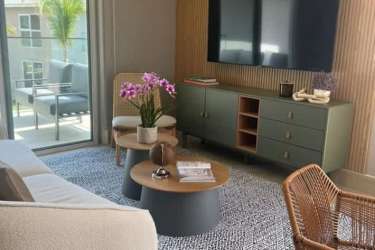 View of pool area and clubhouse by beachfront condos at Playa Caracol Punta Chame Panama