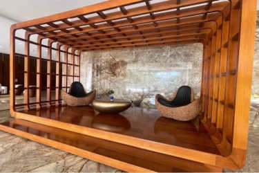 Elegant luxury lobby with wood details and lounge area PH Playa Bonita Panama Oeste