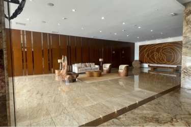 Open living and dining area with balcony access and stunning ocean views at Playa Bonita Panama