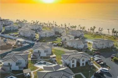 Sunset drone view of PH Brisas de Mar beachfront condominiums at Playa Caracol Panama