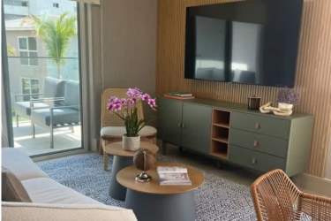 Social clubhouse area with lush green landscaping and ocean views in PH Brisas de Mar Punta Chame Panama