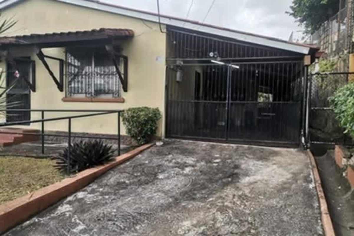 Exterior gated driveway metal security fence ramp garden Betania Panama City