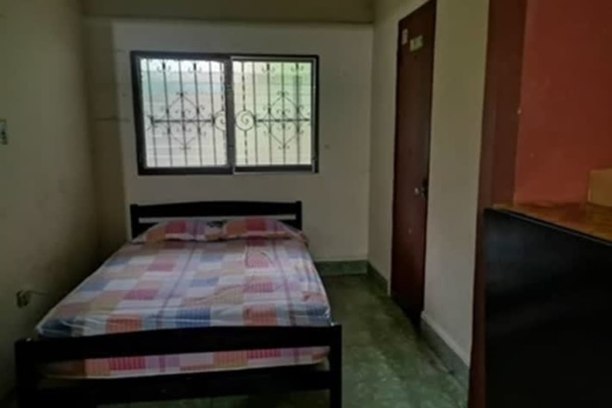 Basic bedroom with metal grilles on window tiled floors Betania Panama