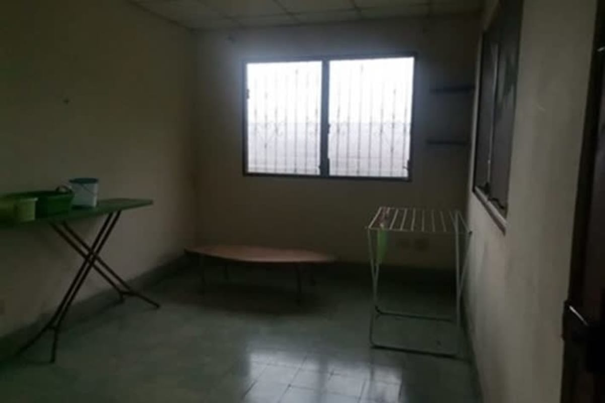 Basic utility laundry space with tiled floor folding table Betania home Panama