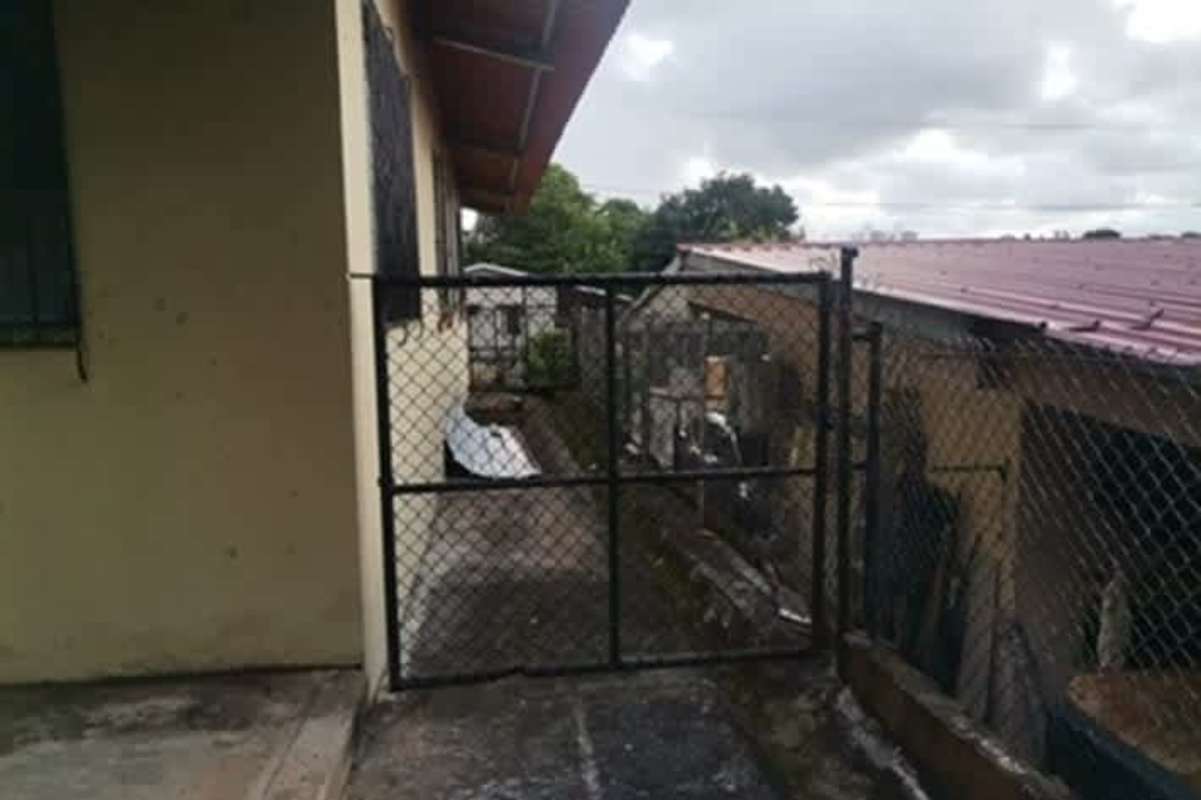 Gated pathway metal roof side exterior Betania Panama City