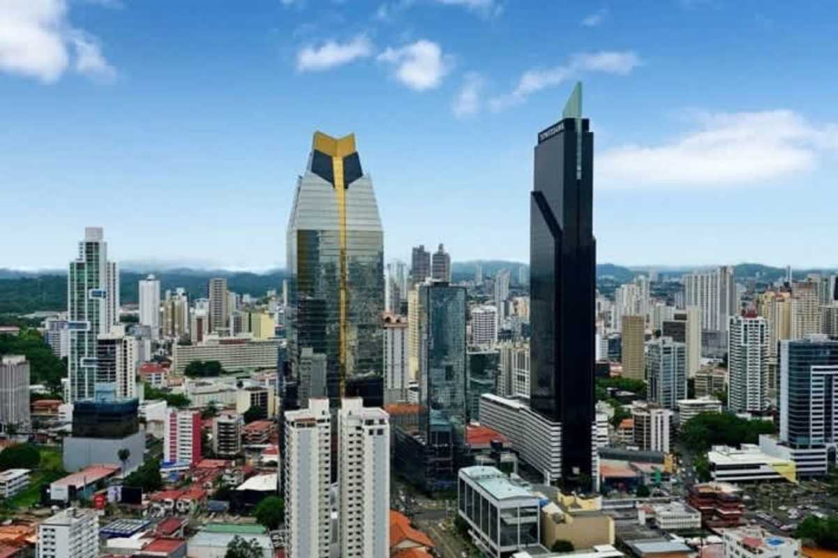 Bright master bedroom with ocean and city view windows in PH Waters on the Bay Panama