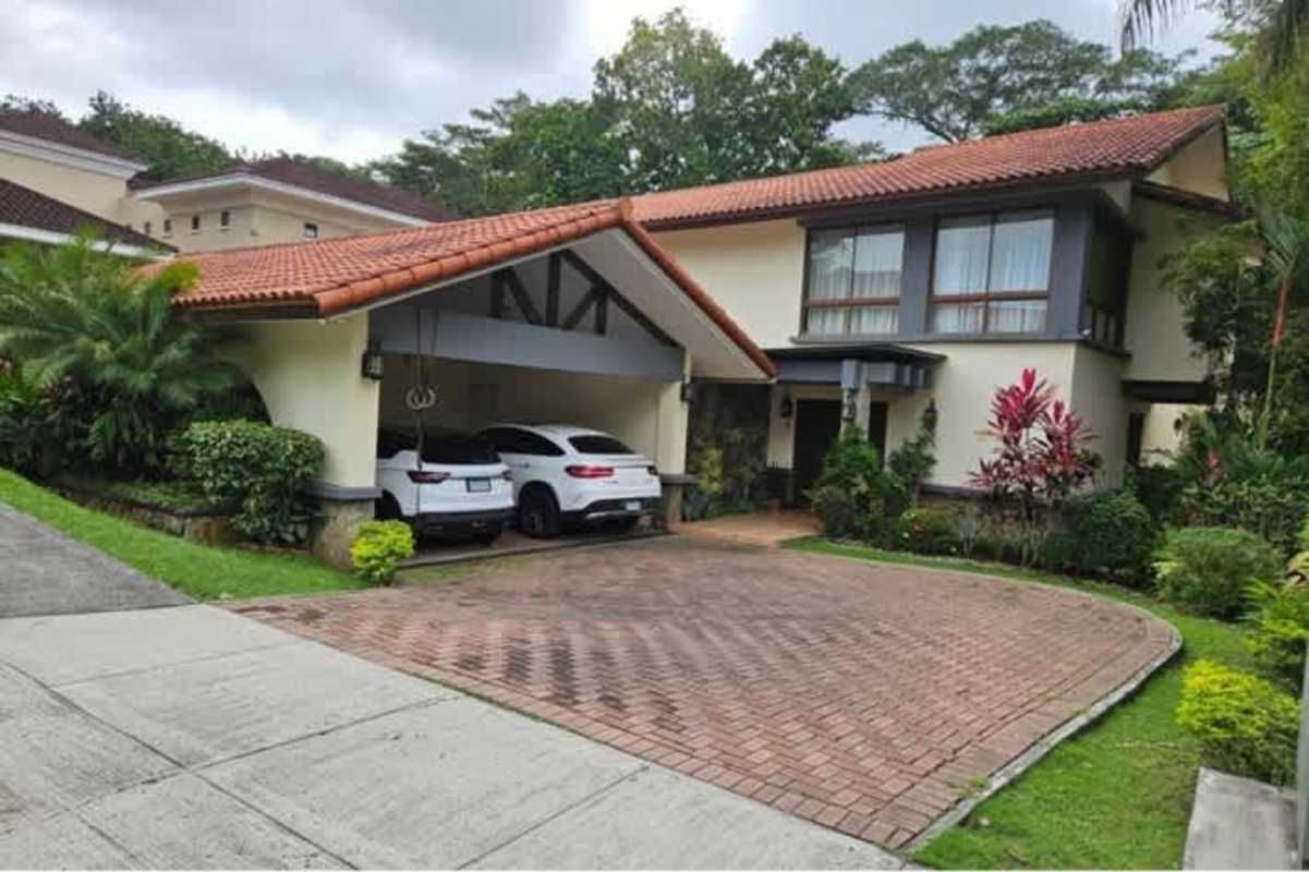 Two-story luxury house with Mediterranean design, carport, and landscaped garden at Camino de Cruces, Panama