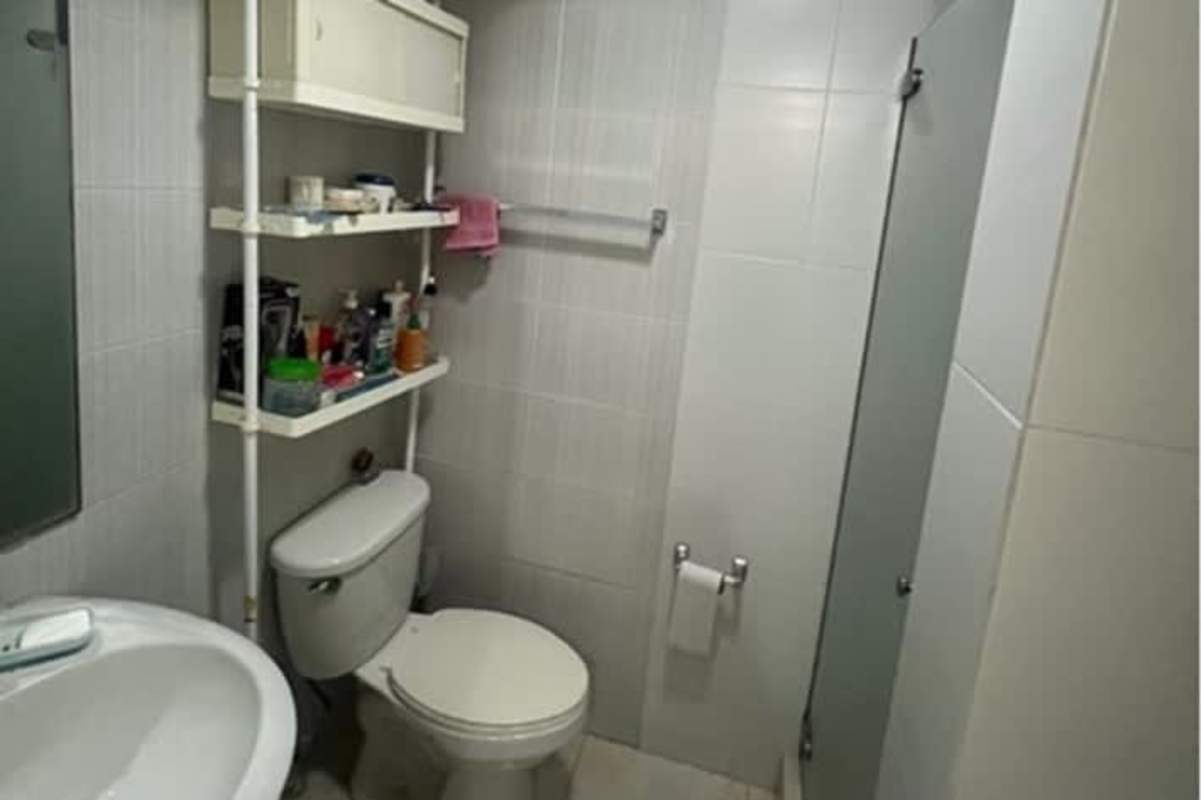 Kitchen with granite countertops, tile walls, stove and washer/dryer hook-up at PH El Mare Betania Panama