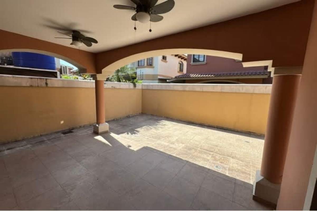 Covered terrace patio area with ceiling fans Costa Sur house