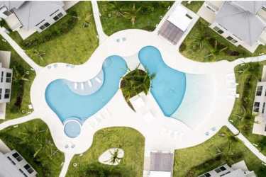 Modern living room open to balcony with Pacific Ocean view at PH Brisas de Mar Playa Caracol Panama