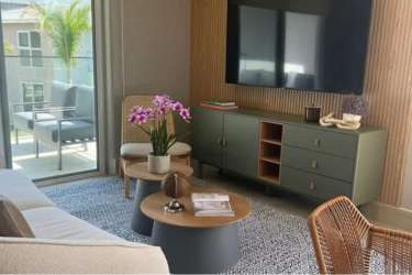 Bright bedroom with large window, balcony access overlooking ocean at PH Brisas de Mar Punta Chame