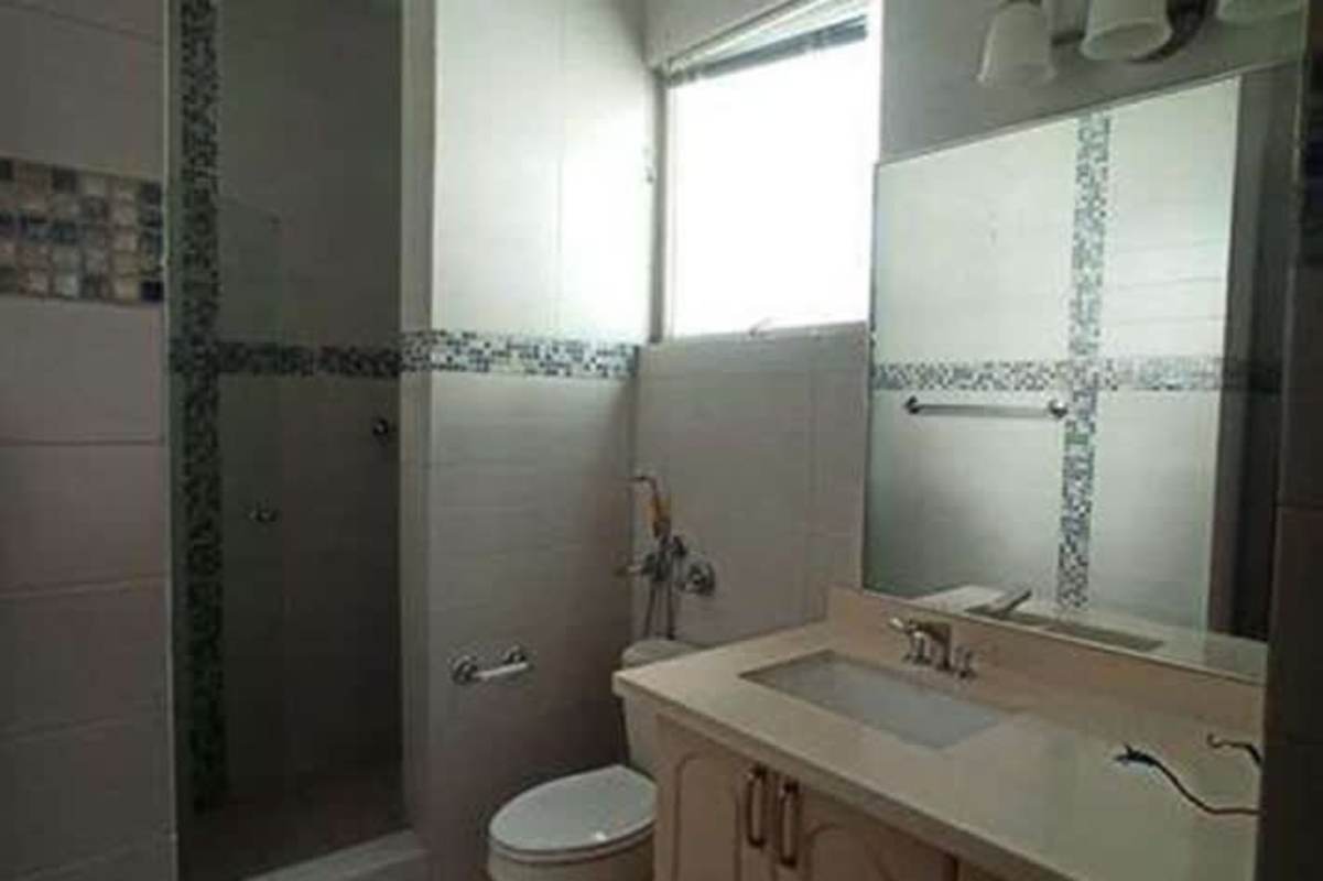 Contemporary bathroom with walk-in shower, mosaic tile accents Yacht Club Tower Panama City