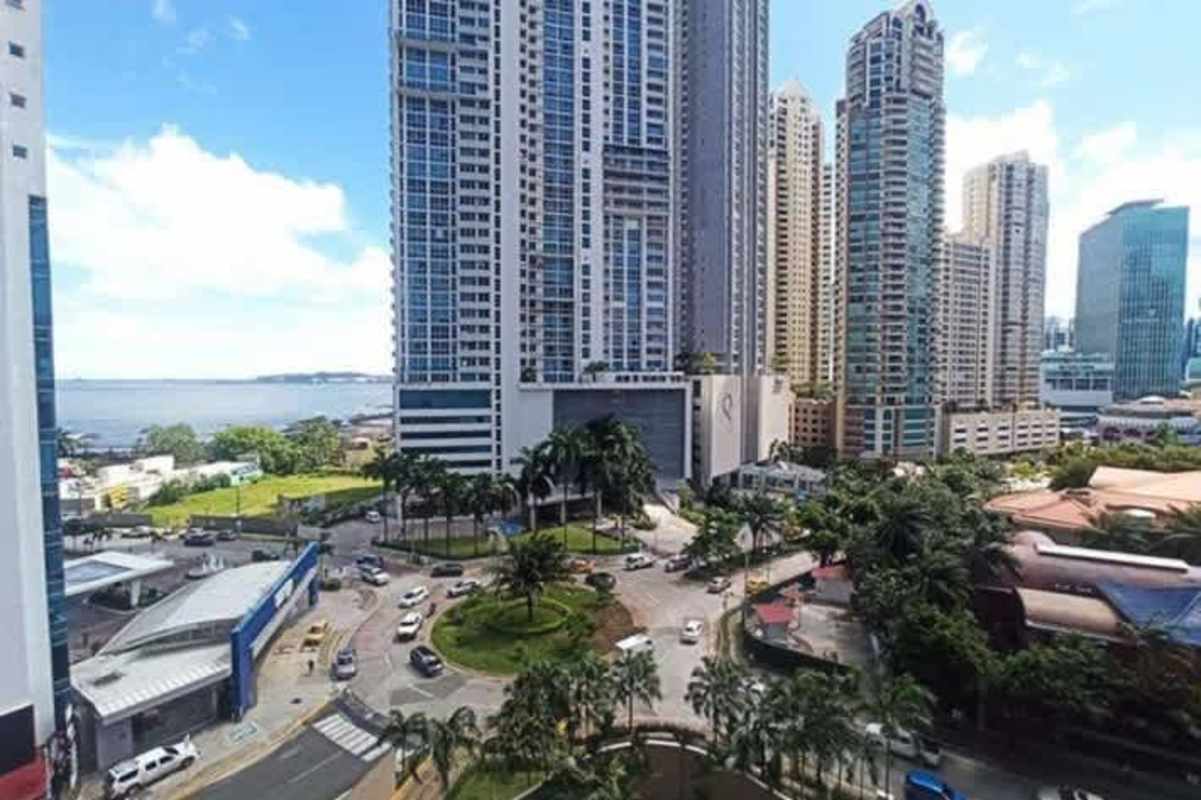 Panoramic view of modern Panama City skyline and waterfront from Yacht Club Tower luxury condo