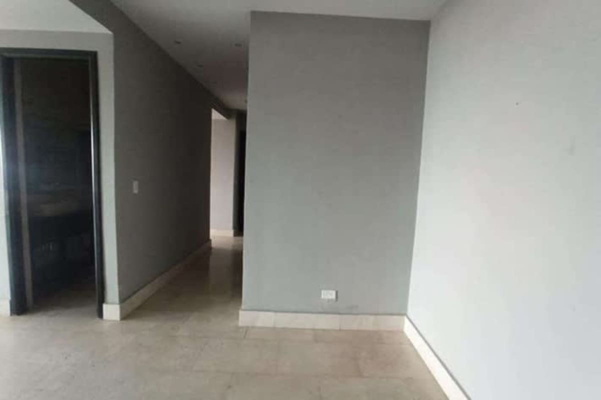 Bright hallway with neutral colors tiled flooring in Yacht Club Tower Panama City luxury apartment