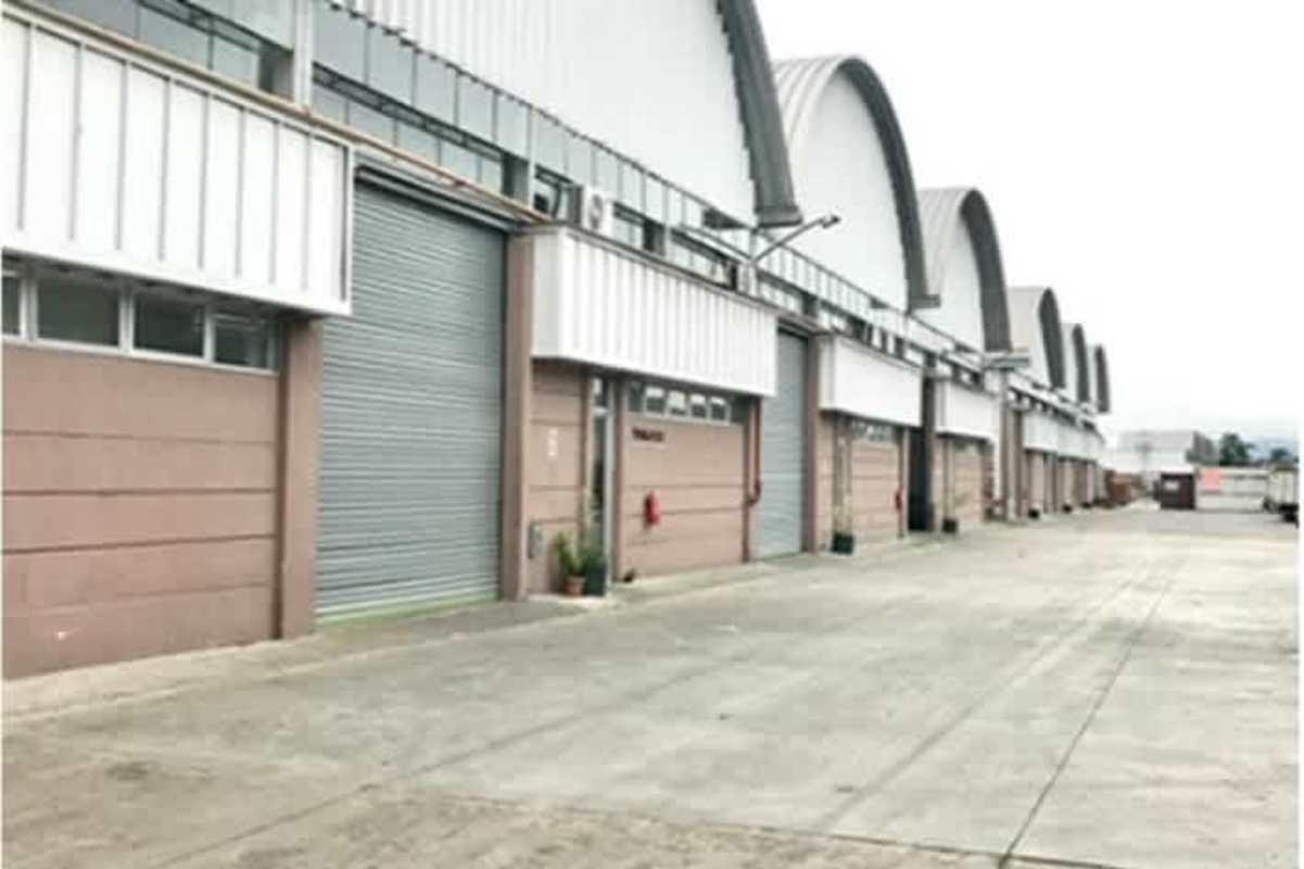 Row of industrial warehouses with parking and loading bays in Villa Zaita Panama City