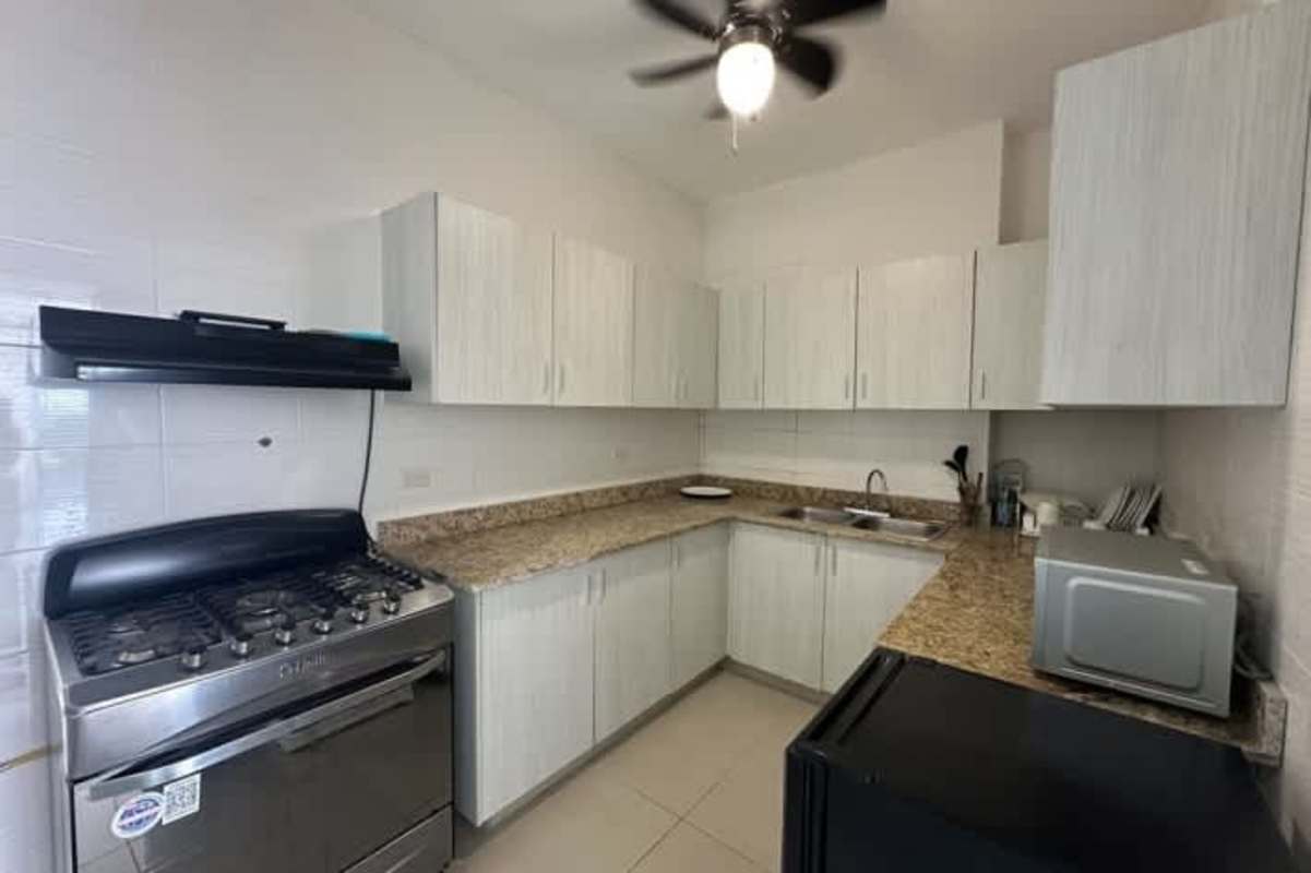 Modern bathroom with glass-enclosed walk-in shower granite top vanity in PH Alfa Betania