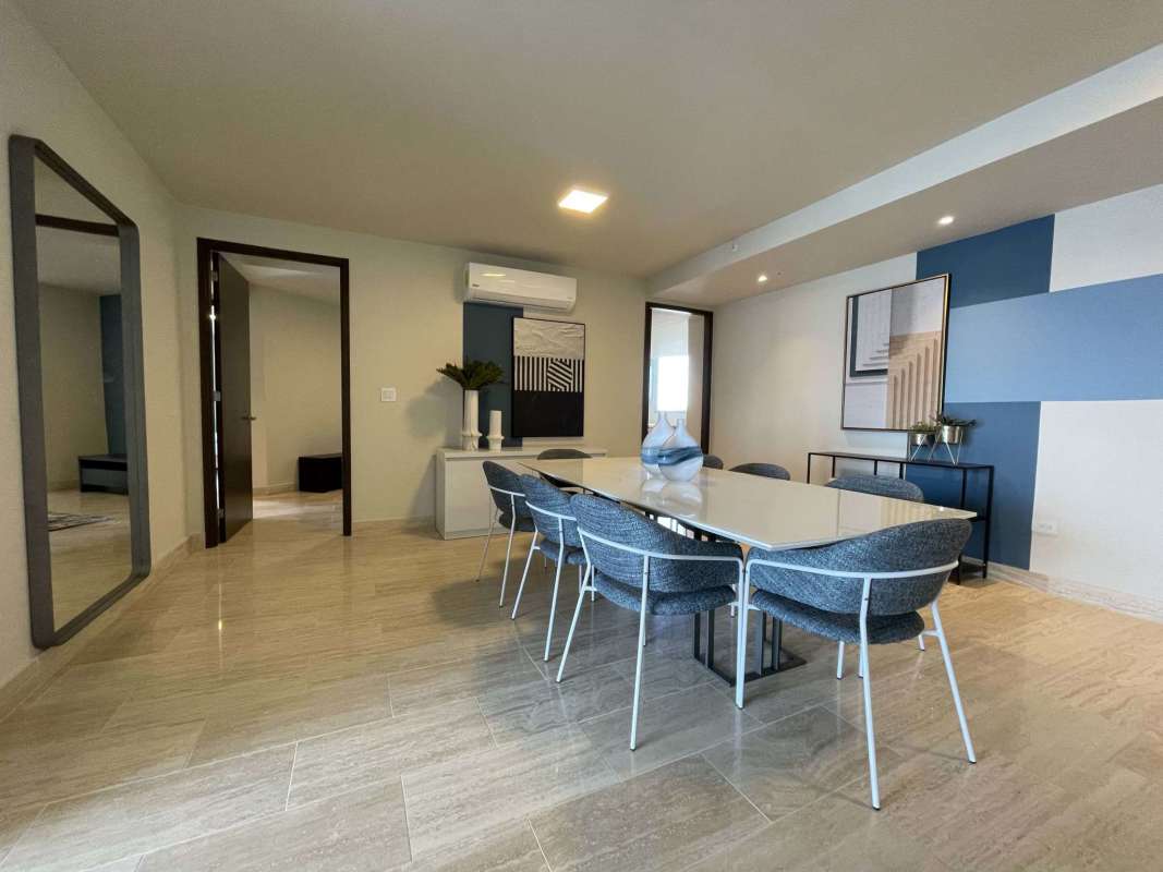 Luxury apartment dining room with modern décor and panoramic city views in The Regent Costa del Este Panama