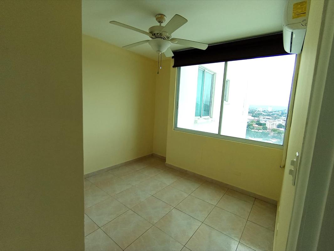 Open-plan living dining area with neutral decor and tiled floor in Edison Park Panama City